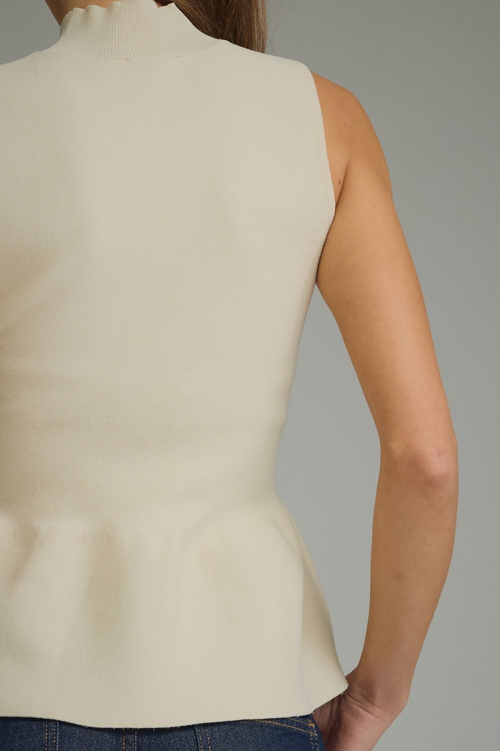 The Ecru Finesse Top | Sleeveless Mock Neck Peplum Top